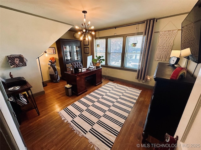 office featuring baseboards, a chandelier, and wood finished floors