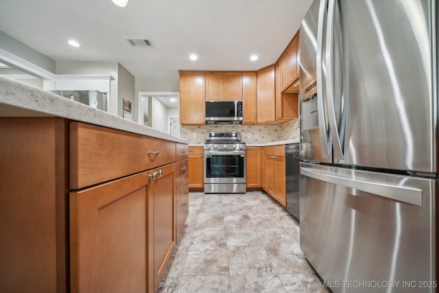 9998 E 460th Rd, Claremore, OK 74017 - kitchen with appliances with stainless steel finishes, light countertops, tasteful backsplash, recessed lighting, and brown cabinetry