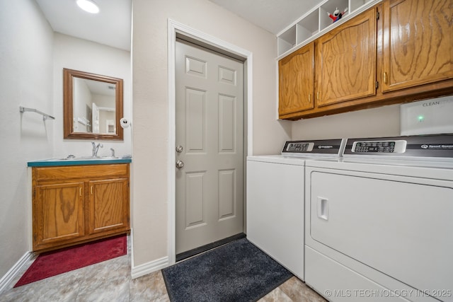 9998 E 460th Rd, Claremore, OK 74017 - laundry room featuring independent washer and dryer, cabinet space, and baseboards