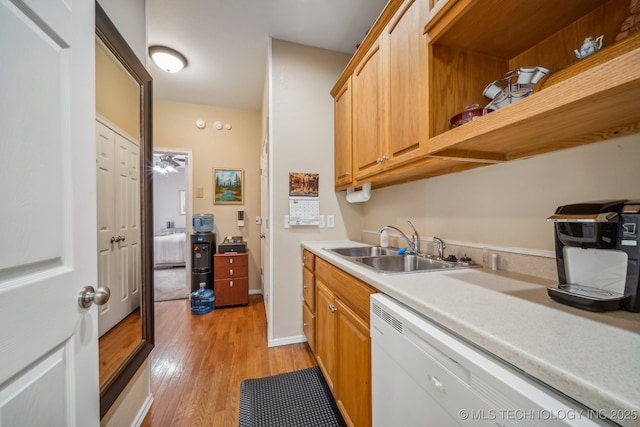 9998 E 460th Rd, Claremore, OK 74017 - kitchen featuring white dishwasher, light wood-type flooring, a sink, light countertops, and open shelves