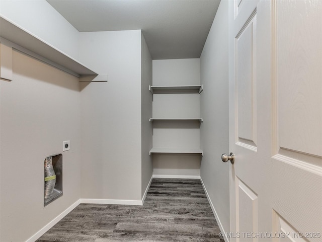 clothes washing area with baseboards, laundry area, wood finished floors, and electric dryer hookup