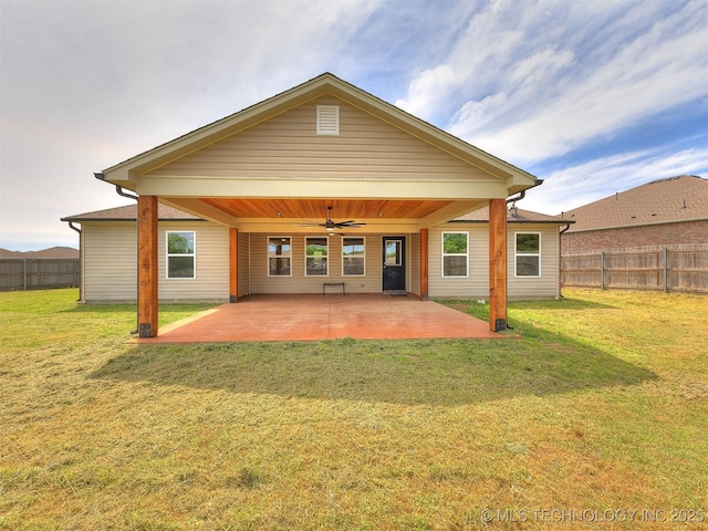 back of house with a ceiling fan, a patio area, a fenced backyard, and a lawn