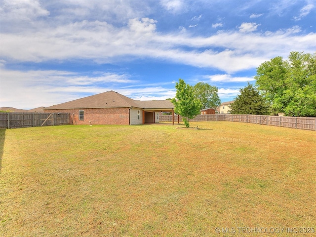 view of yard featuring a fenced backyard