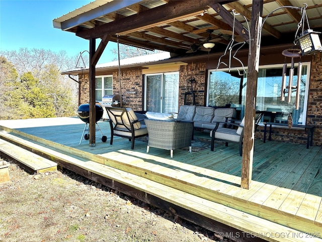 wooden terrace with a ceiling fan