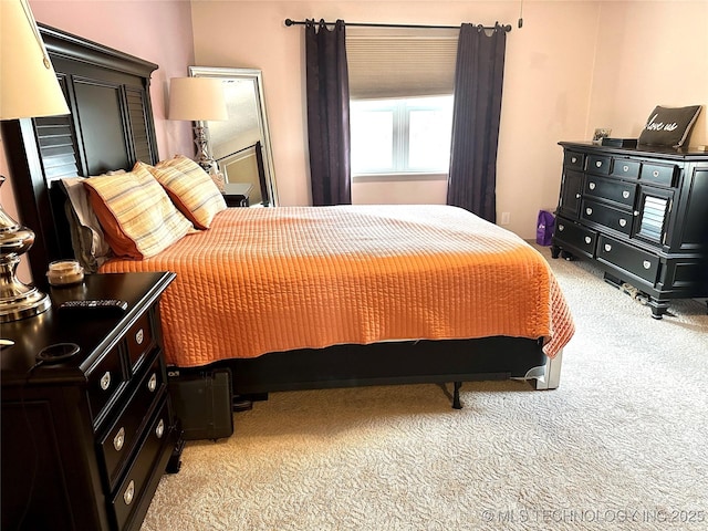 bedroom with light colored carpet