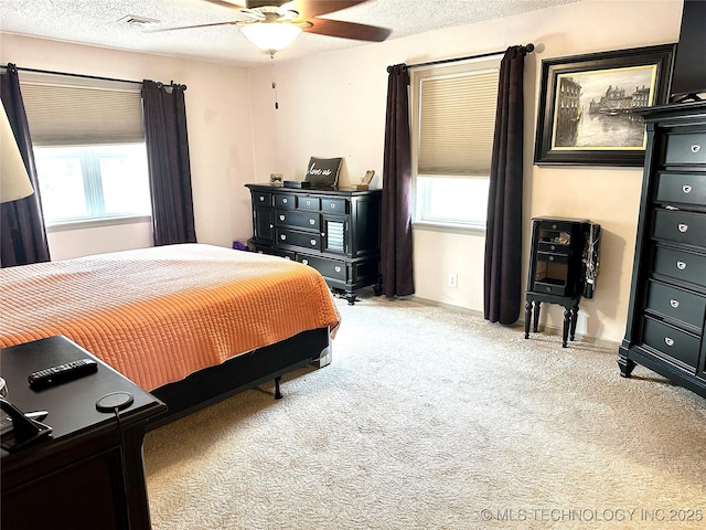 1082 Gaines Creek Loop, Eufaula, OK 74432 - carpeted bedroom featuring a textured ceiling and ceiling fan