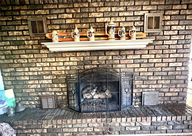 1082 Gaines Creek Loop, Eufaula, OK 74432 - detailed view of a brick fireplace and brick siding