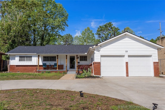 ranch-style home featuring roof with shingles, an attached garage, brick siding, concrete driveway, and covered porch