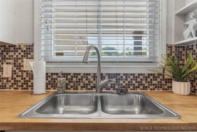 details featuring backsplash and a sink