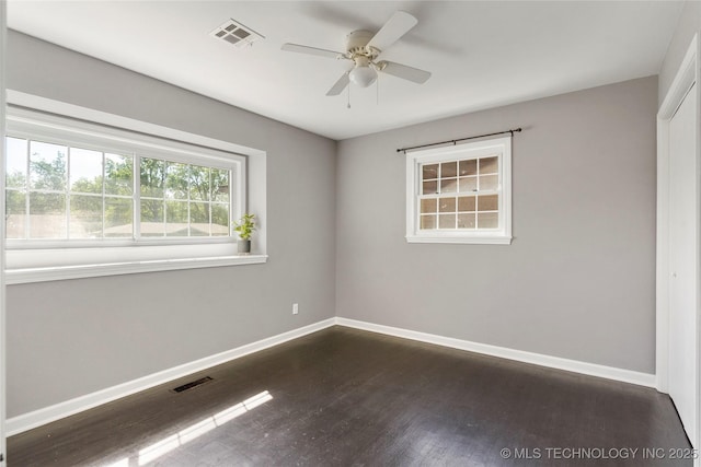 empty room featuring a ceiling fan, baseboards, and visible vents