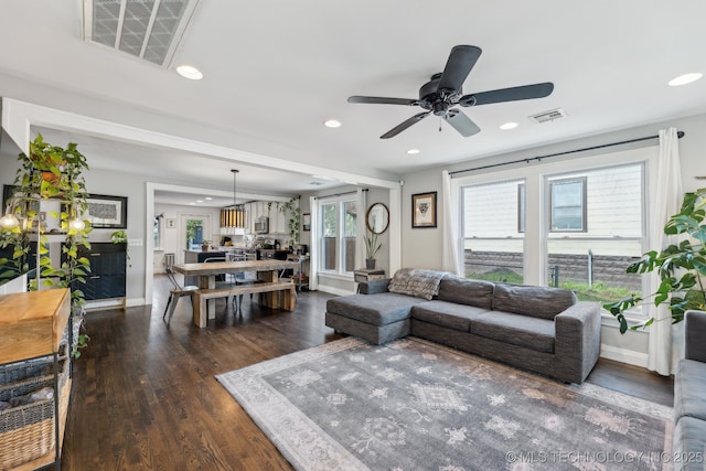 1304 W Easton St, Tulsa, OK 74127 - living area with visible vents, recessed lighting, and dark wood-type flooring