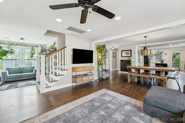 1304 W Easton St, Tulsa, OK 74127 - living room with baseboards, visible vents, wood finished floors, and stairway