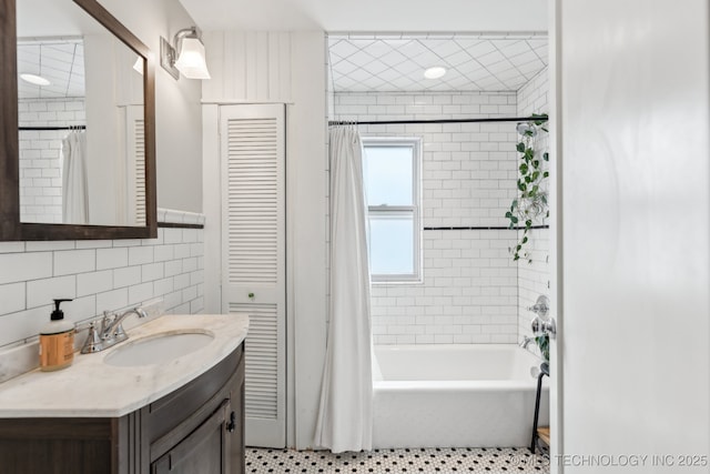 1304 W Easton St, Tulsa, OK 74127 - bathroom featuring tile patterned flooring, vanity, tile walls, shower / tub combo, and backsplash