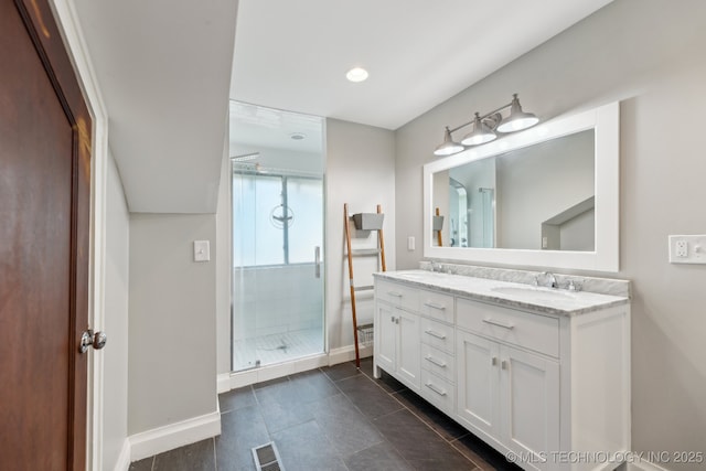 1304 W Easton St, Tulsa, OK 74127 - full bathroom with double vanity, visible vents, a stall shower, a sink, and baseboards