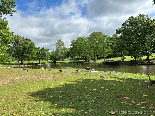 1304 W Easton St, Tulsa, OK 74127 - surrounding community with a water view and a yard
