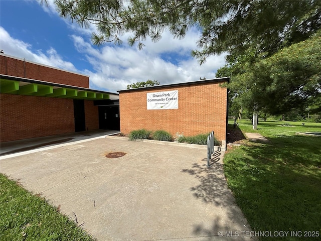 1304 W Easton St, Tulsa, OK 74127 - exterior space with a lawn and brick siding