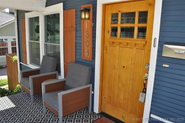 1304 W Easton St, Tulsa, OK 74127 - property entrance with a porch