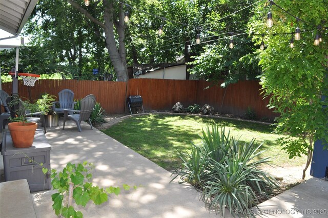 1304 W Easton St, Tulsa, OK 74127 - fenced backyard featuring a patio area
