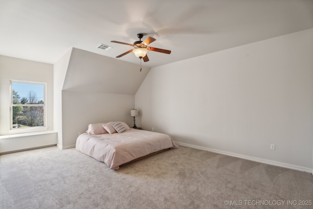 carpeted bedroom featuring a ceiling fan, baseboards, visible vents, and lofted ceiling