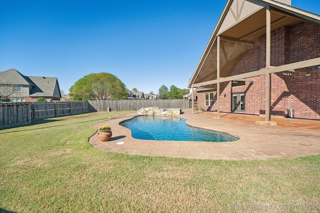 view of pool with french doors, a fenced in pool, a fenced backyard, a yard, and a patio