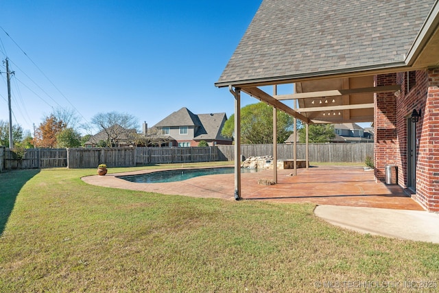 view of yard featuring a patio, a fenced backyard, and a fenced in pool