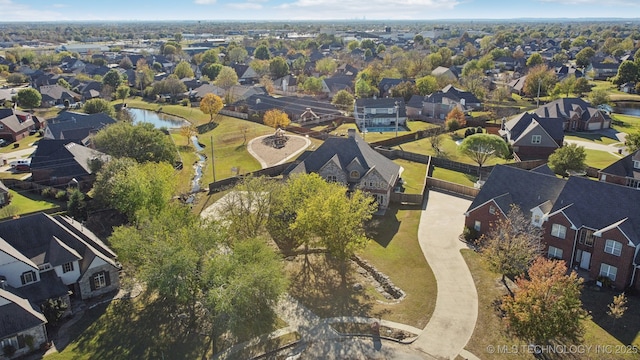 aerial view with a water view and a residential view