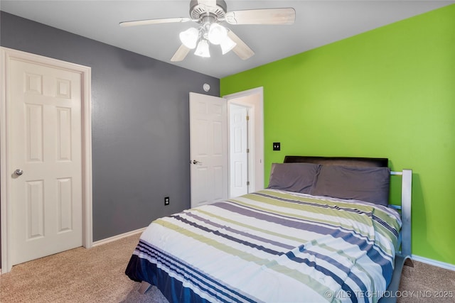 bedroom featuring carpet floors, ceiling fan, and baseboards