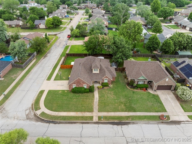 birds eye view of property with a residential view