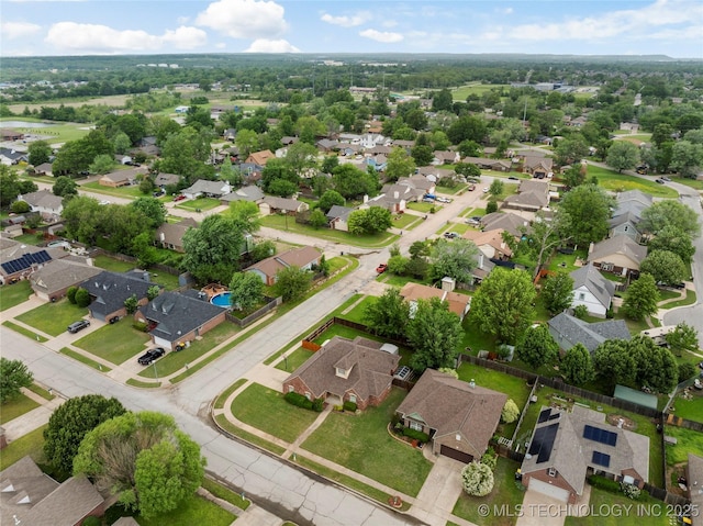birds eye view of property with a residential view