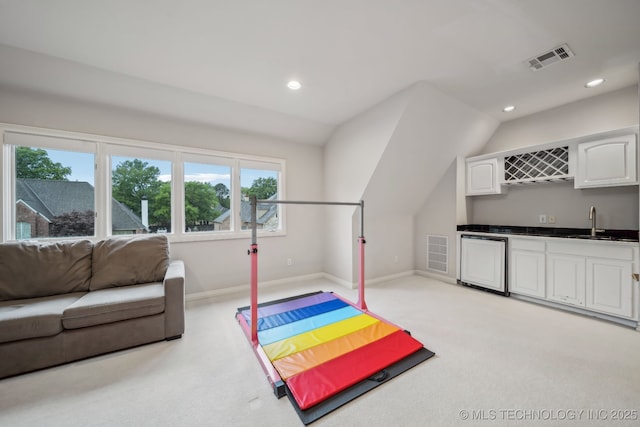 recreation room with carpet flooring, a sink, recessed lighting, wet bar, and visible vents