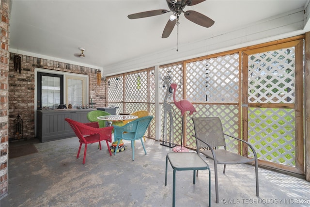 19978 E Murrell Rd, Tahlequah, OK 74464 - sunroom featuring a ceiling fan, a healthy amount of sunlight, and brick wall