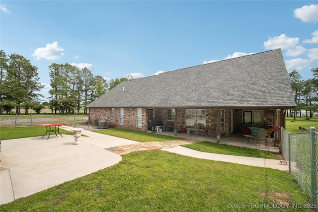 19978 E Murrell Rd, Tahlequah, OK 74464 - rear view of property featuring a lawn, fence, cooling unit, a patio, and roof with shingles