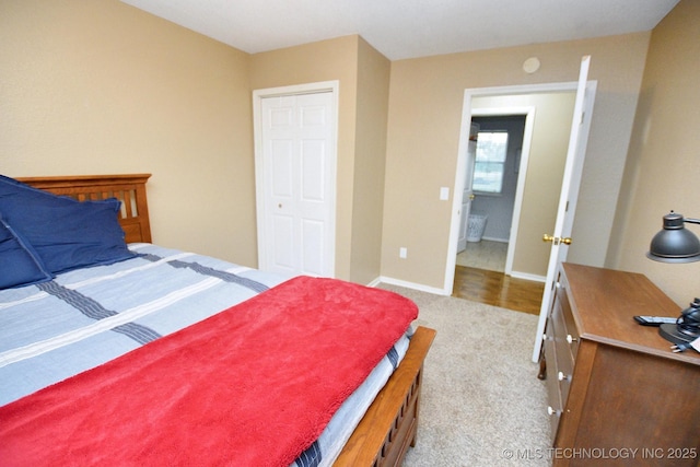 bedroom with baseboards and carpet flooring