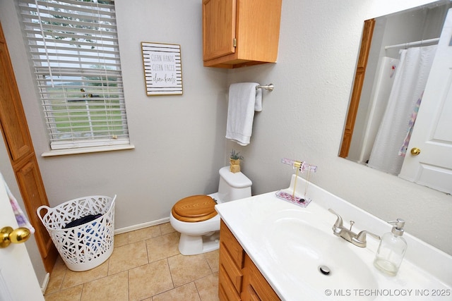 bathroom with tile patterned floors, baseboards, vanity, toilet, and a shower with shower curtain