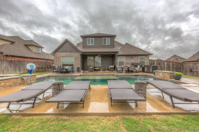 view of swimming pool with a fenced in pool, a fenced backyard, an outdoor hangout area, and a patio