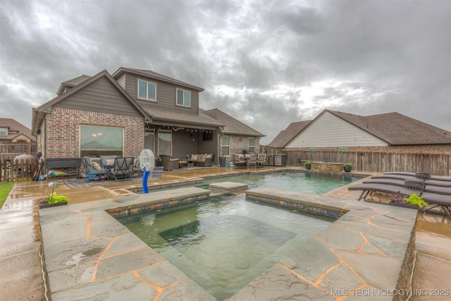 view of swimming pool featuring outdoor lounge area, a fenced backyard, a fenced in pool, an in ground hot tub, and a patio