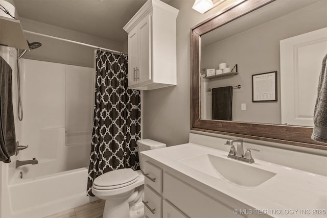 full bath featuring vanity, shower / bath combo, and toilet