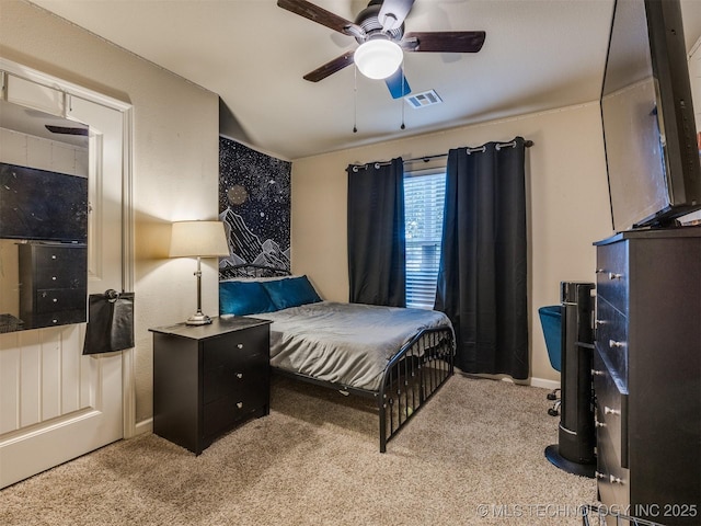 bedroom featuring visible vents, carpet, ceiling fan, and baseboards
