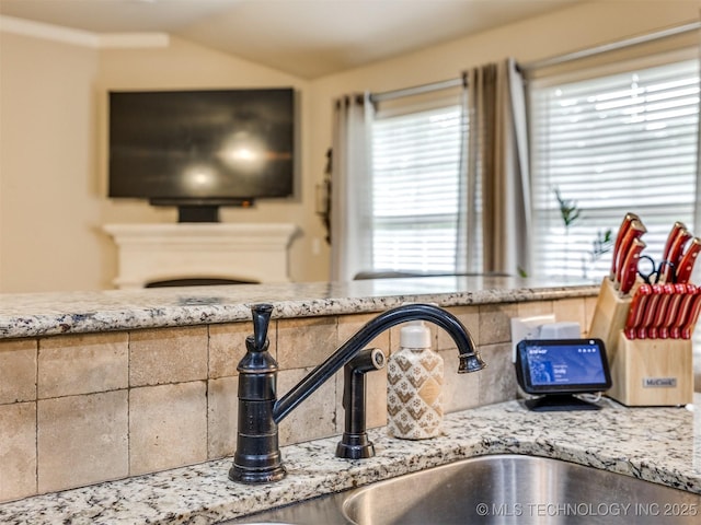 room details with a sink and tasteful backsplash