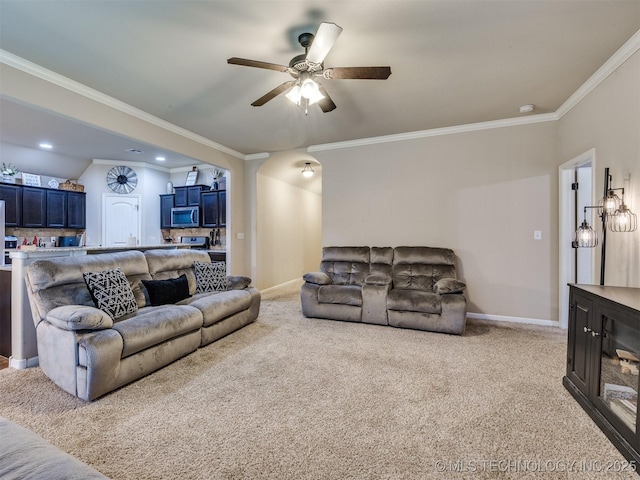 living area featuring crown molding, ceiling fan, light colored carpet, and baseboards