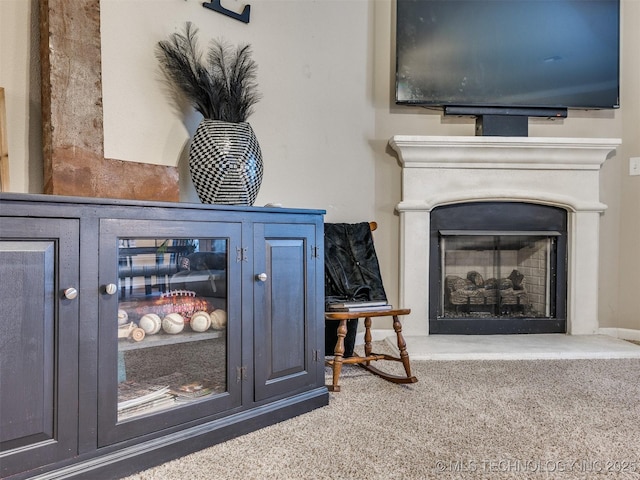 interior details with carpet flooring and a fireplace