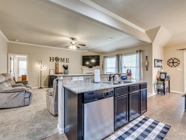 kitchen with a sink, baseboards, stainless steel dishwasher, and open floor plan