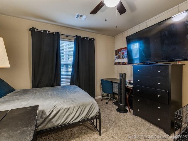 bedroom featuring baseboards, ceiling fan, carpet flooring, and visible vents