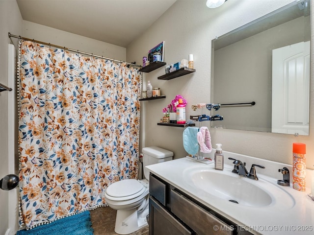 bathroom with tile patterned flooring, a shower with shower curtain, toilet, and vanity