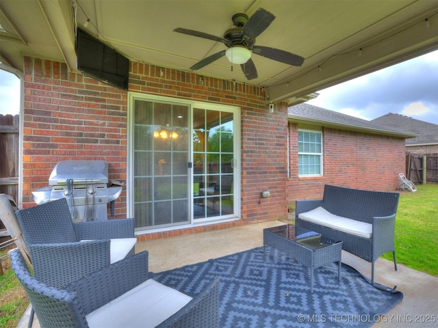 view of patio / terrace with fence, a ceiling fan, outdoor lounge area, and a grill