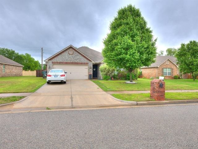 view of front of property with fence, a garage, driveway, and a front lawn