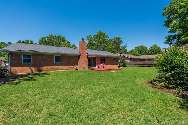 2305 S Hickory Pl, Broken Arrow, OK 74012 - rear view of property with a chimney, brick siding, and a deck