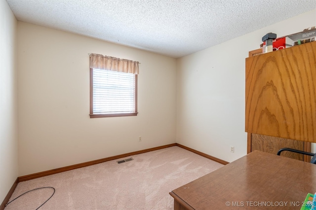2305 S Hickory Pl, Broken Arrow, OK 74012 - carpeted empty room featuring a textured ceiling and baseboards