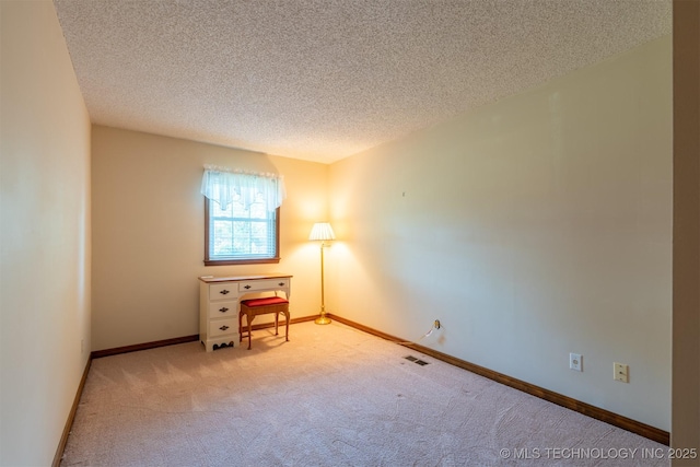 2305 S Hickory Pl, Broken Arrow, OK 74012 - spare room featuring carpet, a textured ceiling, and baseboards