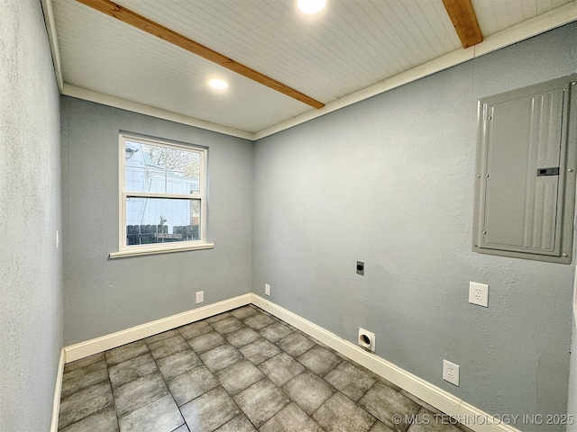 empty room featuring baseboards, recessed lighting, and electric panel